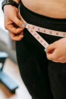 https-//www.pexels.com/photo/woman-measuring-her-hips-6551070