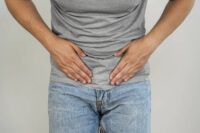 Surgeons who treat hernias regularly hear the same story from patients who have been living with one for months or years: they were hoping it would resolve on its own. It never does. The tissue defect that allows internal organs to protrude through a weakened muscle wall cannot heal without intervention. According to guidelines published by the European Hernia Society, watchful waiting may be appropriate for patients with minimal symptoms, but the majority will eventually require surgical repair. That clinical reality shapes how hernia care works today. The question facing most patients is not whether to treat the problem, but when and how. For those living in Thailand or considering medical care in Bangkok, understanding the options available can make the decision considerably clearer. What Actually Happens Inside the Body A hernia develops when internal tissue, typically fat or a section of intestine, pushes through a weak spot in the surrounding muscle wall. The result is often a visible bulge that becomes more pronounced when standing, coughing, or lifting something heavy. The most common type, an inguinal hernia appearing in the groin area, accounts for roughly 75% of all abdominal wall hernias according to data from the American Hernia Society, and affects men far more frequently than women. Other varieties include femoral hernias (occurring just below the groin, more common in women), umbilical hernias (near the navel), and incisional hernias that develop at the site of previous surgery. Each type carries its own risk profile. Femoral hernias, for instance, have a higher likelihood of becoming trapped or "incarcerated" than inguinal hernias, which is why surgeons often recommend earlier intervention for them. The danger everyone wants to avoid is strangulation, a situation where the blood supply to the trapped tissue gets cut off. This transforms a manageable condition into a surgical emergency. Warning signs include sudden severe pain, nausea, vomiting, and a bulge that becomes tender or changes color. When strangulation occurs, the timeline for surgery shifts from elective to urgent, typically within hours. How Hernia Surgery Has Evolved Hernia repair has changed considerably over the past three decades. The introduction of synthetic mesh in the 1980s reduced recurrence rates dramatically. Studies cited in the HerniaSurge international guidelines show that suture-only repairs carried recurrence rates of roughly 10-15%, while modern mesh-based techniques have brought that figure down to around 1-4% depending on hernia type and surgical approach. Open surgery remains the traditional approach and still has its place. The surgeon makes a single incision directly over the hernia site, repositions the protruding tissue, and reinforces the weakened area with sutures and typically mesh. For very large hernias, complex cases, or patients who have had multiple previous abdominal surgeries, open repair often makes the most sense. Recovery typically takes three to six weeks before returning to full activity. Laparoscopic repair, performed through several small incisions using a camera and specialized instruments, has become increasingly common for straightforward inguinal and umbilical hernias. A 2018 Cochrane review comparing techniques found that laparoscopic repair resulted in faster return to normal activities and lower rates of wound infection, though overall recurrence rates were similar to open repair. Most patients undergoing laparoscopic surgery can resume light work within one to two weeks. Robotic-assisted surgery represents the newest option, offering surgeons enhanced precision and three-dimensional visualization. Some Bangkok hospitals now use robotic systems for complex or recurrent hernias. However, the technology adds cost, and current evidence does not show superior outcomes for routine cases compared to conventional laparoscopy. It remains a valuable tool for specific situations rather than a universal upgrade. Why Patients Choose Bangkok for Hernia Care Thailand's private hospital sector has invested heavily in surgical infrastructure over the past two decades. Major Bangkok hospitals now perform thousands of hernia repairs annually, and several hold Joint Commission International accreditation, the same standard applied to top American hospitals. For international patients, several practical factors come into play beyond clinical quality. Waiting times are typically short. While patients in some national health systems may wait months for elective hernia surgery, Bangkok's private hospitals can often schedule procedures within days. Pricing transparency is another draw. Most hospitals provide itemized cost estimates upfront, and the total expense for hernia repair, including surgeon fees, facility charges, and a short hospital stay, often runs significantly less than comparable procedures in the United States, United Kingdom, or Australia. Language barriers are less of an obstacle than many expect. Major Bangkok hospitals employ multilingual coordinators and maintain medical staff fluent in English, Japanese, Arabic, and other languages. Preoperative consultations can sometimes be conducted via video call before arrival, and detailed discharge instructions are provided in the patient's preferred language. International patients should plan carefully around follow-up care. While most hernia surgeries are straightforward, complications can occasionally arise in the weeks after the procedure. Those traveling from abroad should either plan to stay in Bangkok for at least 10-14 days post-surgery or arrange in advance for their home physician to provide follow-up care upon return. What Recovery Actually Looks Like The experience of recovery varies more than most patients anticipate. Some people feel surprisingly good within 48 hours and need to be reminded not to overdo it. Others experience more discomfort than expected and require a full week before feeling like themselves. Both trajectories fall within normal range, and surgeons generally advise patients to let their body guide the pace. The first few days typically involve managing soreness, some bruising around the incision site, and general fatigue. Most surgeons recommend walking around starting on the day of surgery to promote circulation and reduce the risk of blood clots. Driving usually becomes possible once emergency braking can be performed comfortably, typically after five to seven days for laparoscopic patients. Physical restrictions matter. Lifting anything heavier than about five kilograms should be avoided for at least two weeks, and most guidelines advise waiting four to six weeks before resuming strenuous exercise or heavy manual labor. Return to work depends heavily on job demands. Someone with a desk job might be back within a week; someone whose work involves physical labor may need considerably longer. Chronic pain after hernia surgery remains a concern that the medical community takes seriously. Research published in The Lancet estimates that 10-12% of patients experience some degree of persistent discomfort after inguinal hernia repair. The risk appears lower with laparoscopic approaches and in the hands of high-volume surgeons. Asking a prospective surgeon about their experience level and complication rates is entirely reasonable. Making the Decision For patients living with symptomatic hernia, the calculation is usually straightforward. The surgery is safe, recovery is manageable, and the alternative is a condition that will almost certainly worsen over time. For those with small, asymptomatic hernias, the decision involves more nuance and is worth discussing carefully with a surgeon who can assess individual risk factors. Quality of life often tips the balance. If activities are being avoided because of a hernia, if there is ongoing worry about what might happen, or if daily routine is already affected, surgery is probably the right choice. Modern techniques are reliable, and outcomes from experienced surgeons at well-equipped facilities are consistently good. The best outcomes come from informed patients working with qualified surgeons. Understanding the options, asking direct questions about experience and complication rates, and choosing a facility with strong surgical standards puts patients in the best position to resolve the problem and return to the activities that matter to them. For patients in Bangkok or those considering treatment in Thailand, Samitivej Hospitals offers comprehensive hernia care with experienced general surgeons and modern surgical facilities. Learn more about hernia surgery in Bangkok. References This article draws on the international HerniaSurge guidelines for groin hernia management (2018), guidelines from the European Hernia Society, Cochrane systematic reviews on hernia repair techniques, and epidemiological data from the American Hernia Society. Patients seeking detailed clinical information may consult these sources through medical databases such as PubMed.