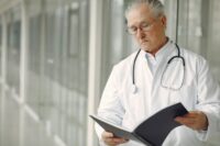doctor-reviewing-chart-medmal.jpg