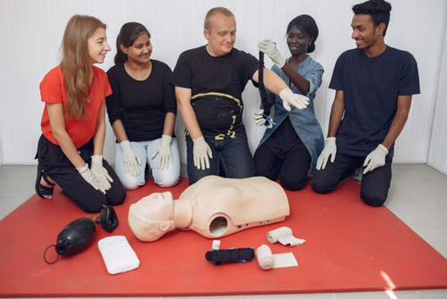 two-women-learing-cpr-on-dummy