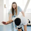 physiotherapist-exercising-man