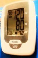 Blood pressure monitor reading 120/80 copyright American Heart Association