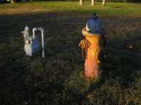 "fire hydrant and electrical box at sunset" by Jo Guldi is licensed under CC BY 2.0. To view a copy of this license, visit: https://creativecommons.org/licenses/by/2.0