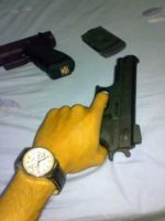 “Me holding USP gun” by Nghị Trần is licensed under CC BY 2.0