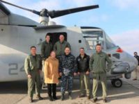 Following the landing of a U.S. Marine Core MV-22, Naval Medical Research Unit – Dayton (NAMRU-Dayton) welcomes crew members at Wright-Patterson Air Force Base, December 19, 2017. NAMRU-Dayton has been tasked as the lead agency for the Navy to investigate tilt-rotor aircrafts potential effects of flight and vibration on aircrews. Pictured with the USMC Air Test and Evaluation Squadron Two One crew is the coordination team: Ms. Elizabeth Miller, U.S. Air Force School of Aerospace Medicine; Captain Rees Lee, Commanding Officer of NAMRU-Dayton; and Lieutenant Commander Matthew Doubrava, Senior Medical Officer at NAMRU-Dayton. (U.S. Navy photo by Public Affairs, Naval Medical Research Unit - Dayton)