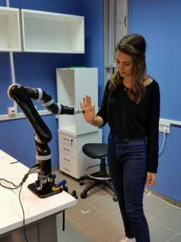 Ben-Gurion University of the Negev student researcher Shir Kashi interacts with robotic arm as part of her research in personalizing human-robot interactions to develop an interactive movement protocol for rehabilitation.