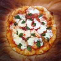 "Margherita pizza" by Joy is licensed under CC BY 2.0. To view a copy of this license, visit: https://creativecommons.org/licenses/by/2.0