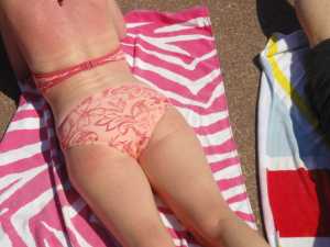 “Dymchurch Beach - May 2012 - Sunburn with Matching Bikini” by Gareth Williams is licensed under CC BY 2.0